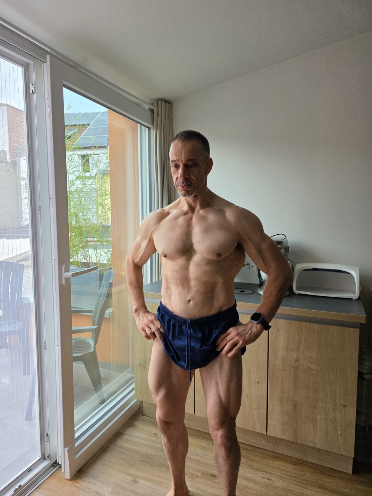 Bahri Performance - front pose, hands on hips, abs and chest